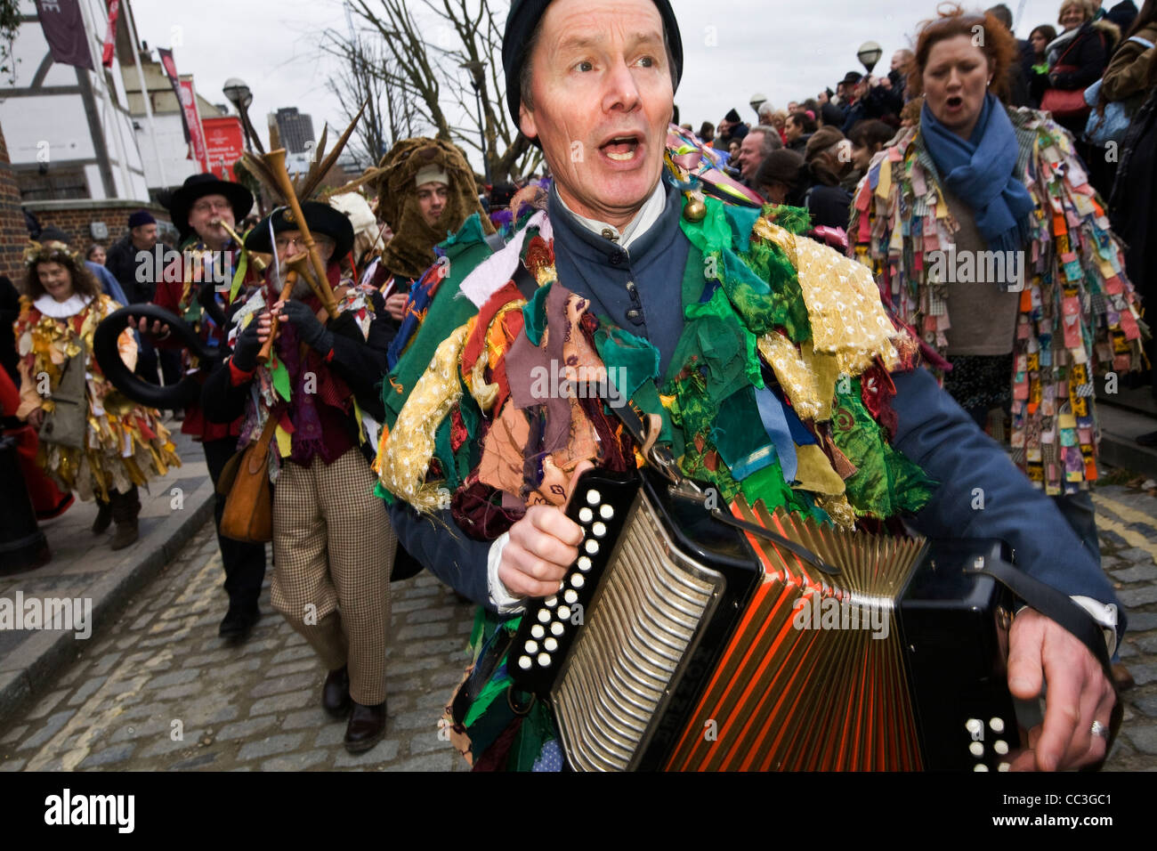 Performers and musicians accompany an annual traditional folklore play celebrating a 'wassail' to herald the new year Stock Photo