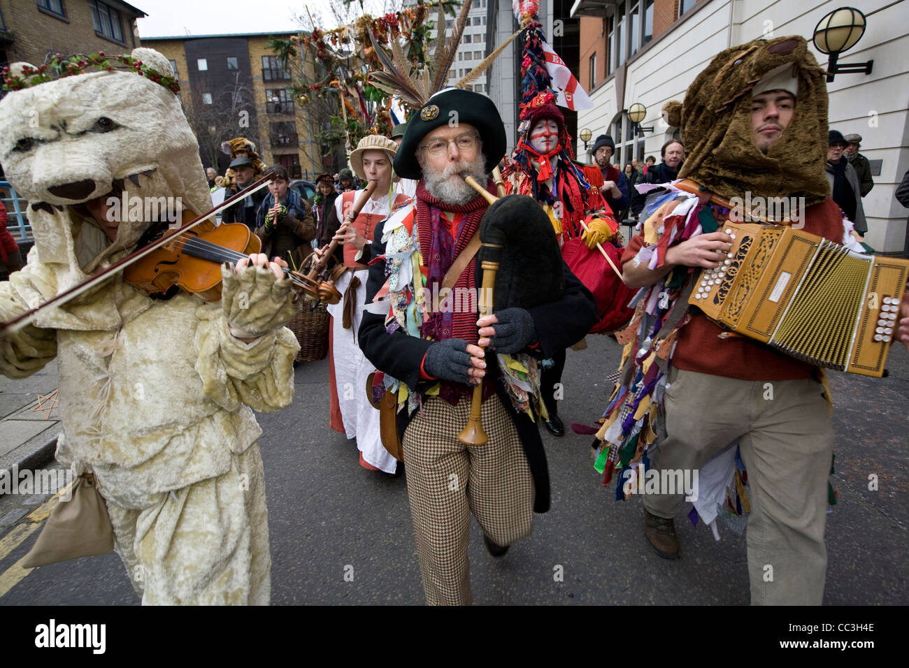 Performers and musicians accompany an annual traditional free theatre celebrating a 'wassail' to herald the new year Stock Photo