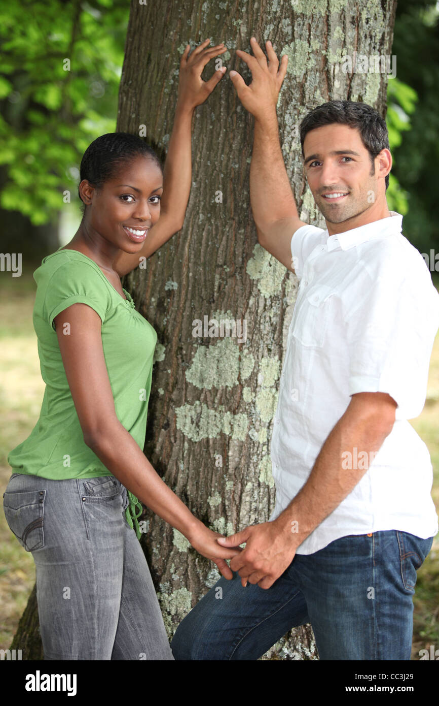 couple holding hands in the park Stock Photo - Alamy