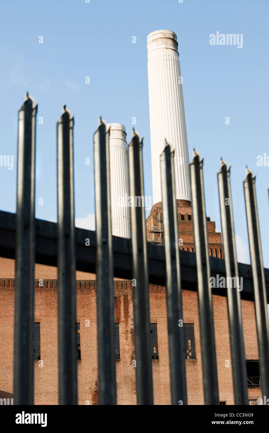 Battersea Power Station as seen from the East Gate with railings in foreground Stock Photo