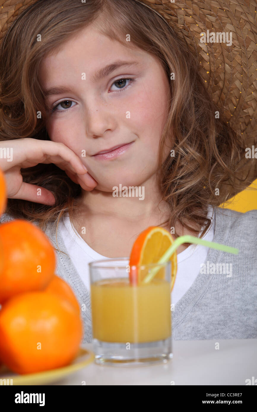 little girl drinking orange juice Stock Photo Alamy