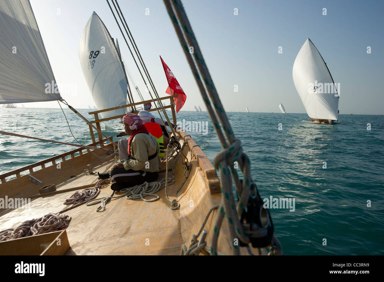 On board a traditional sailing Dhow during a race Stock Photo