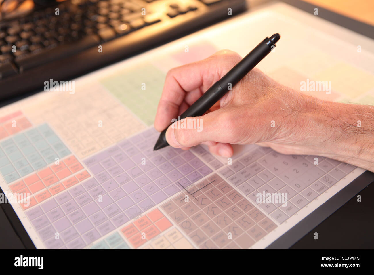 ARCHITECT WORKING ON CAD TABLET Stock Photo