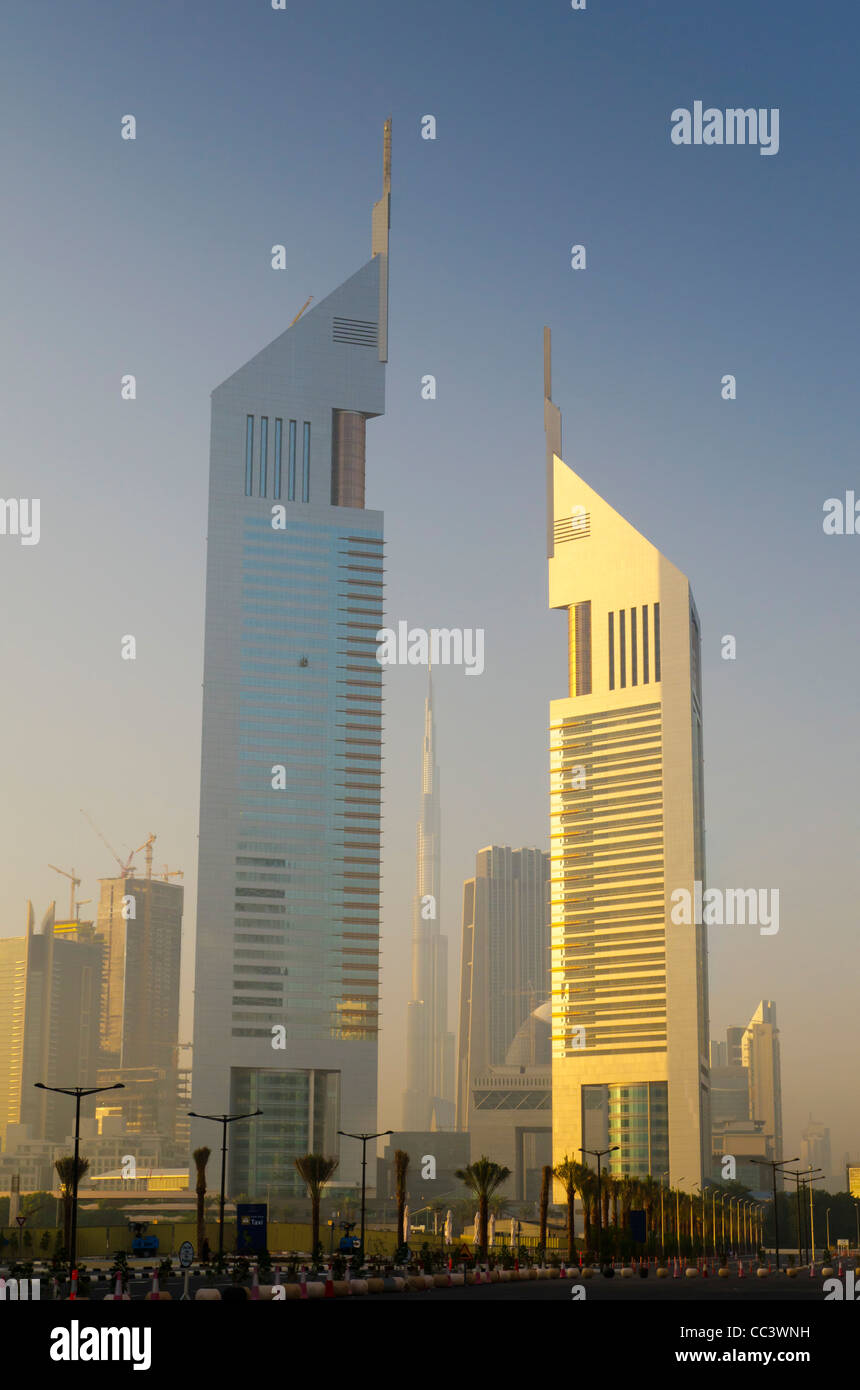 UAE, Dubai, Sheikh Zayed Road, Emirates Towers and Burj Khalifa beyond Stock Photo