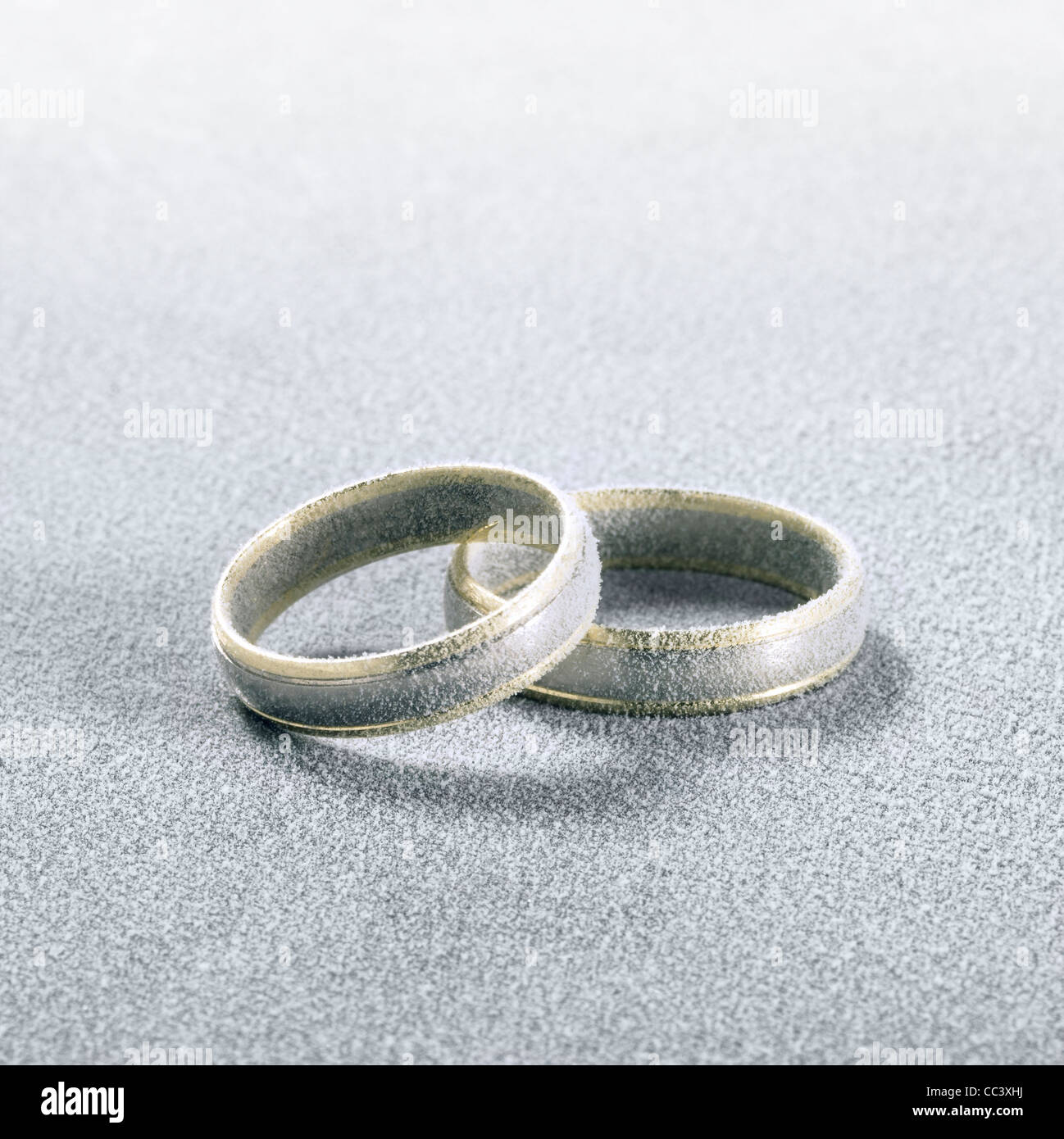 studio photography of two frosted wedding rings in cold ambiance Stock ...