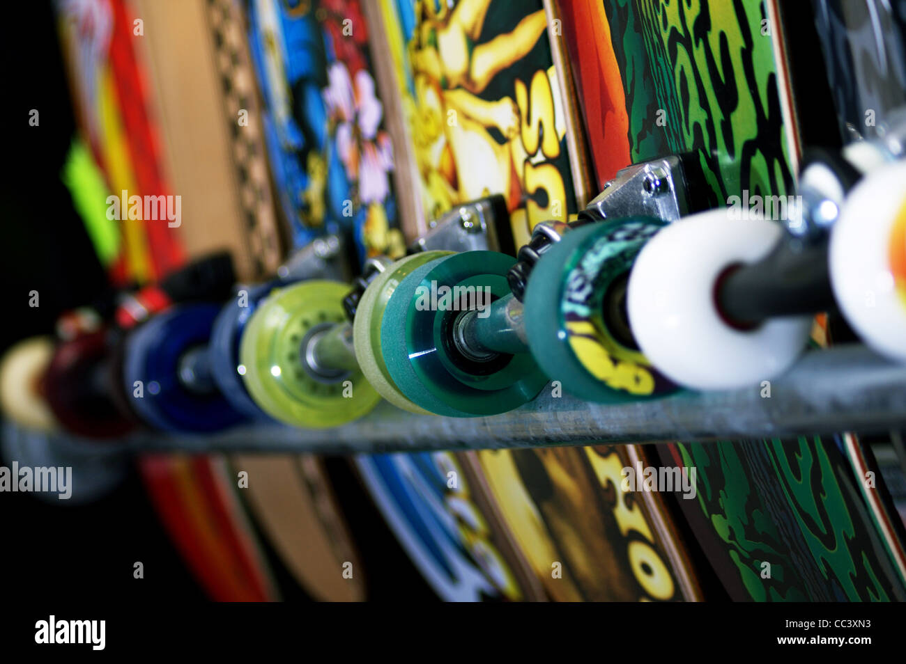 A row of skateboards on sale in a skate shop, Swansea, UK Stock Photo