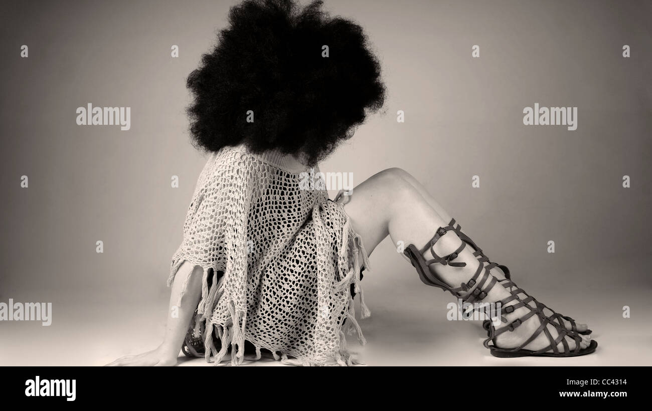 Woman with an afro wig on. Stock Photo