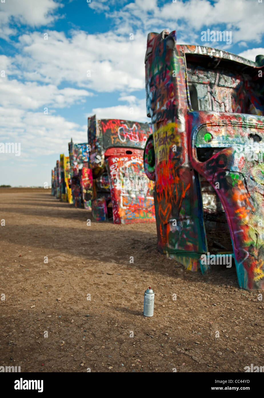 Discarded spray paint cans left by graffiti artists in the fields