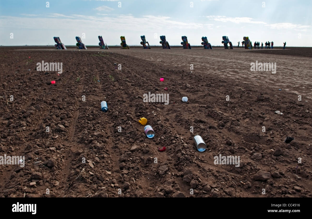 Discarded spray paint cans in the fields around The Cadillac Ranch in