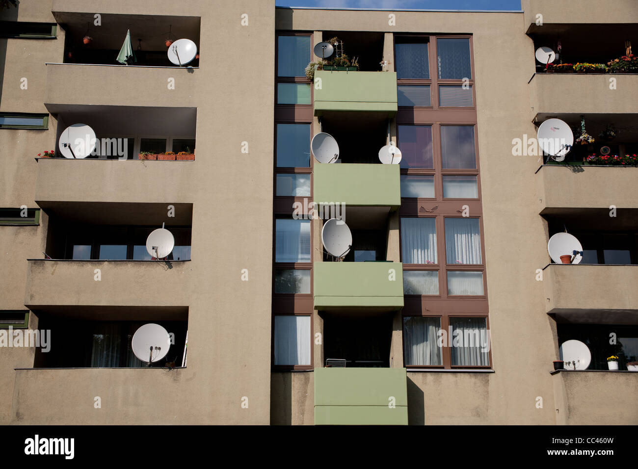 Satellite dishes on an apartment block Stock Photo