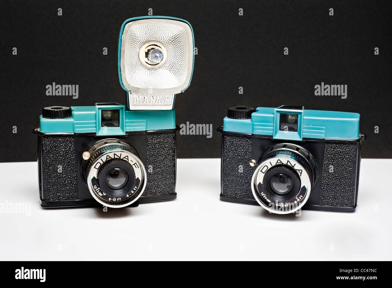 A pair of vintage 1960's and '70's Diana Chinese plastic 120 film Cameras, one with a flash one without. Stock Photo