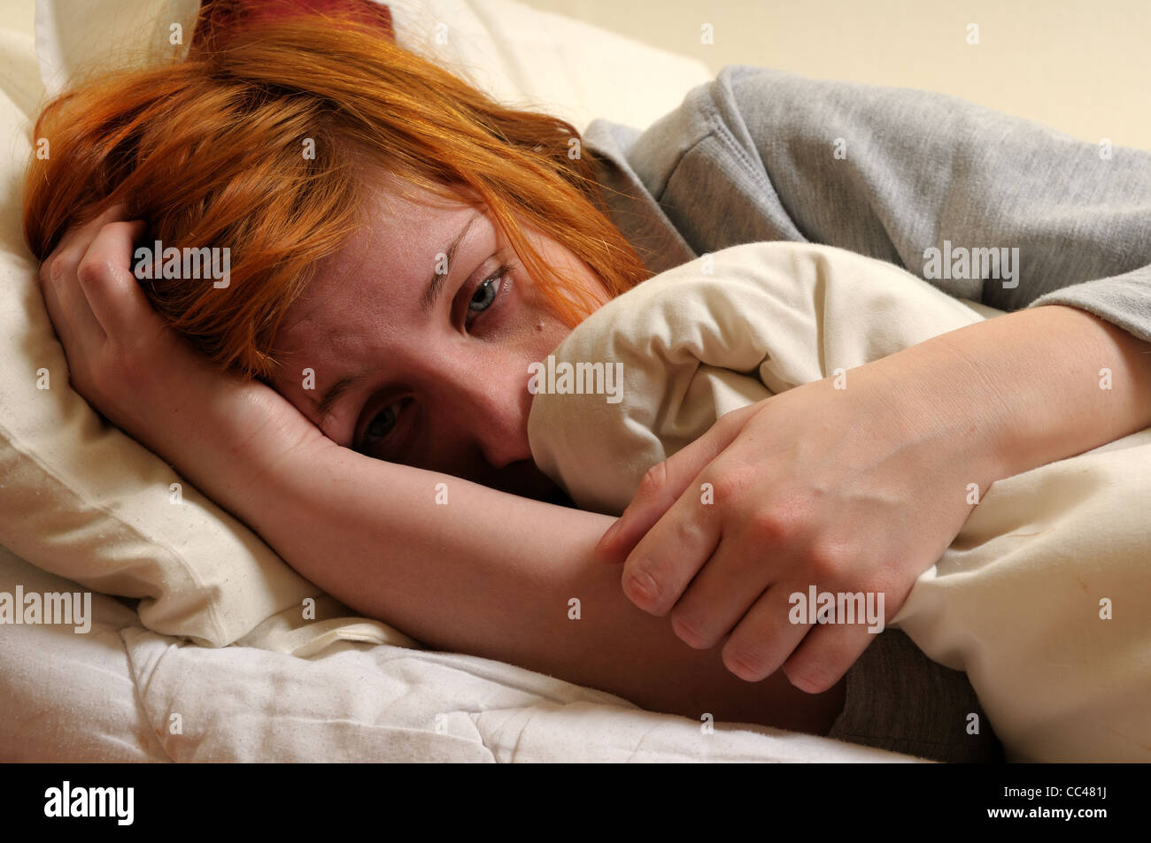 Young Women In Bed Unwell. Stock Photo