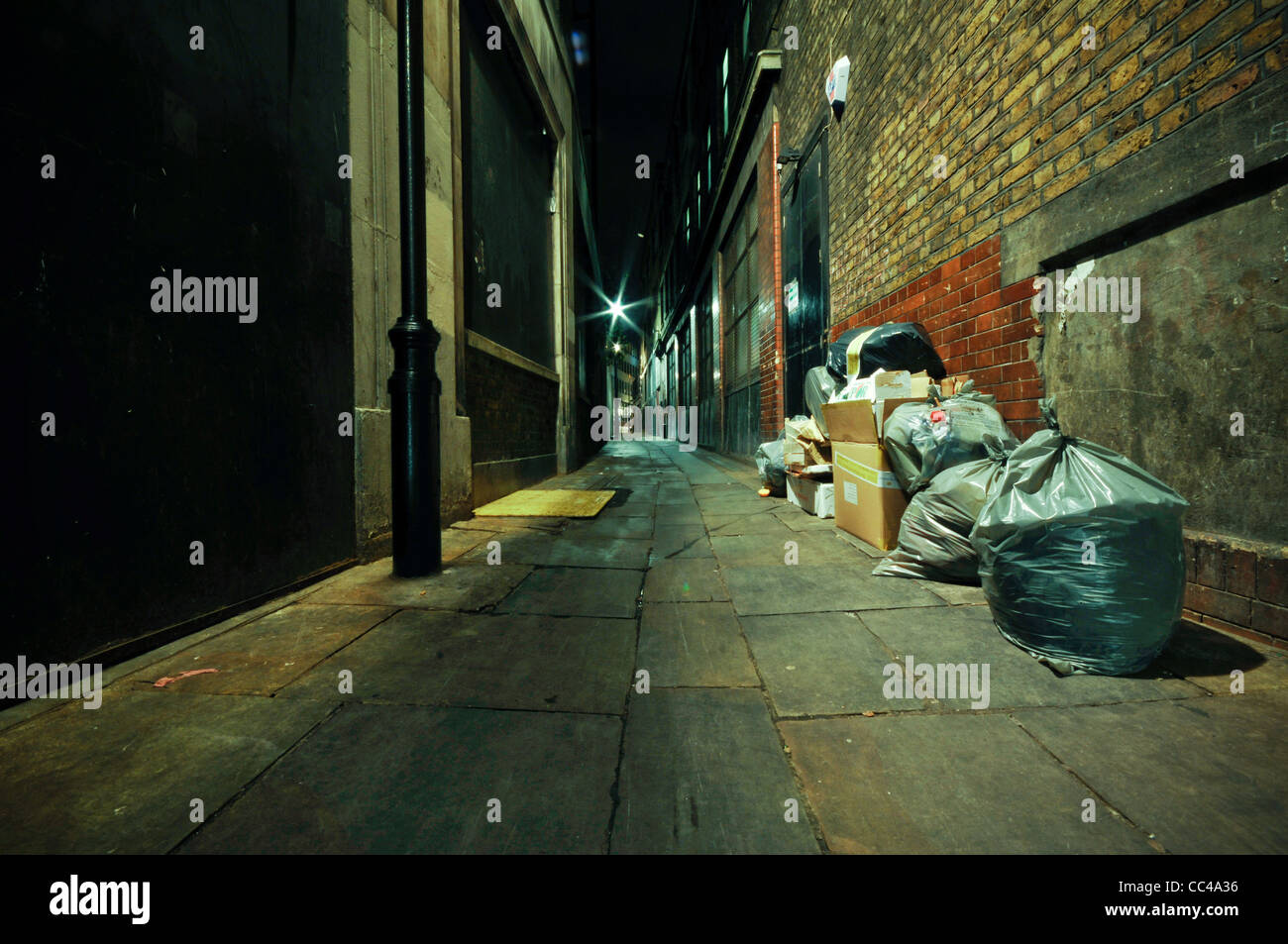 Rubbish on the street in London photographed at night Stock Photo Alamy