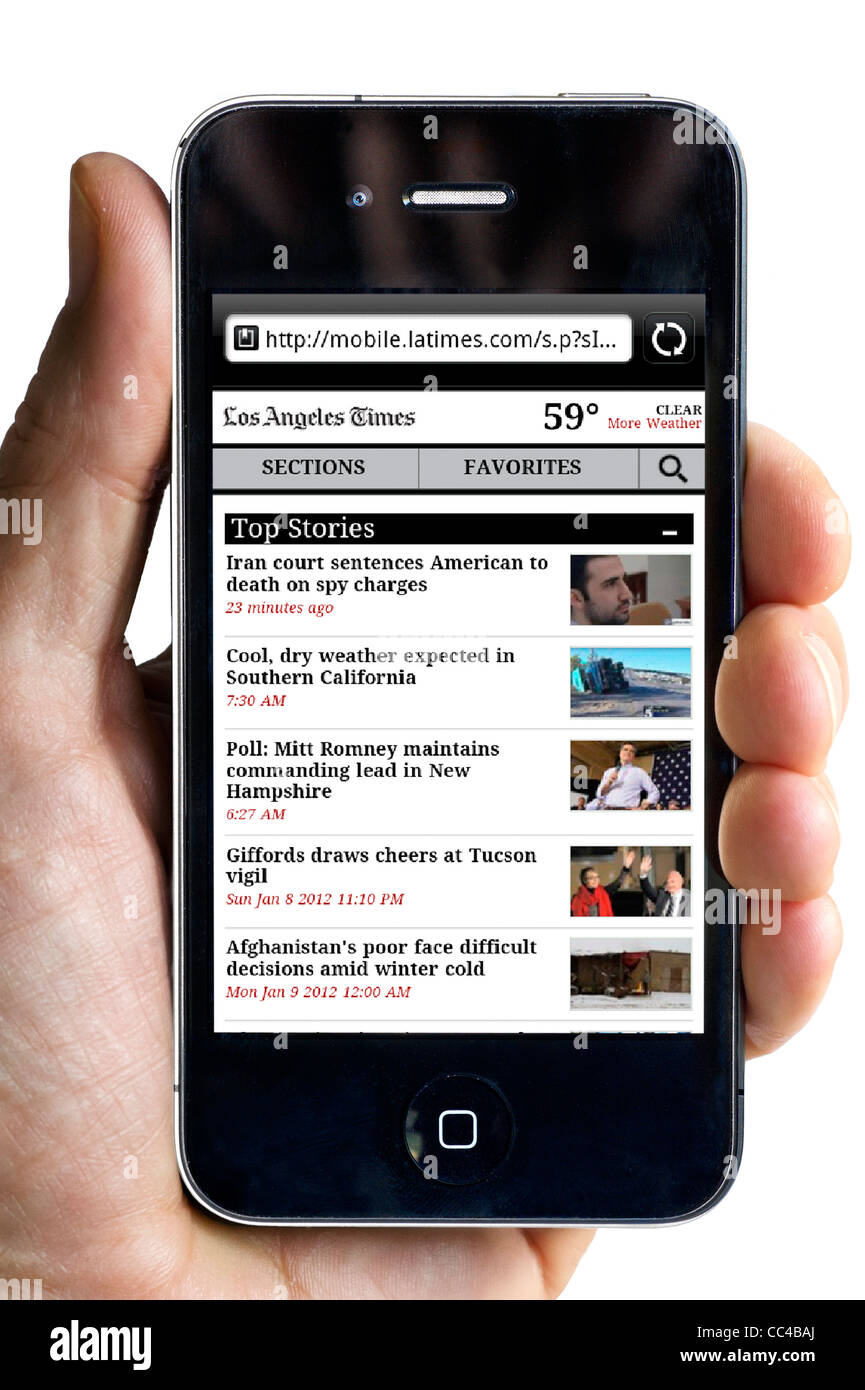 Reading The Los Angeles Times online edition on an Apple iPhone 4 smartphone Stock Photo