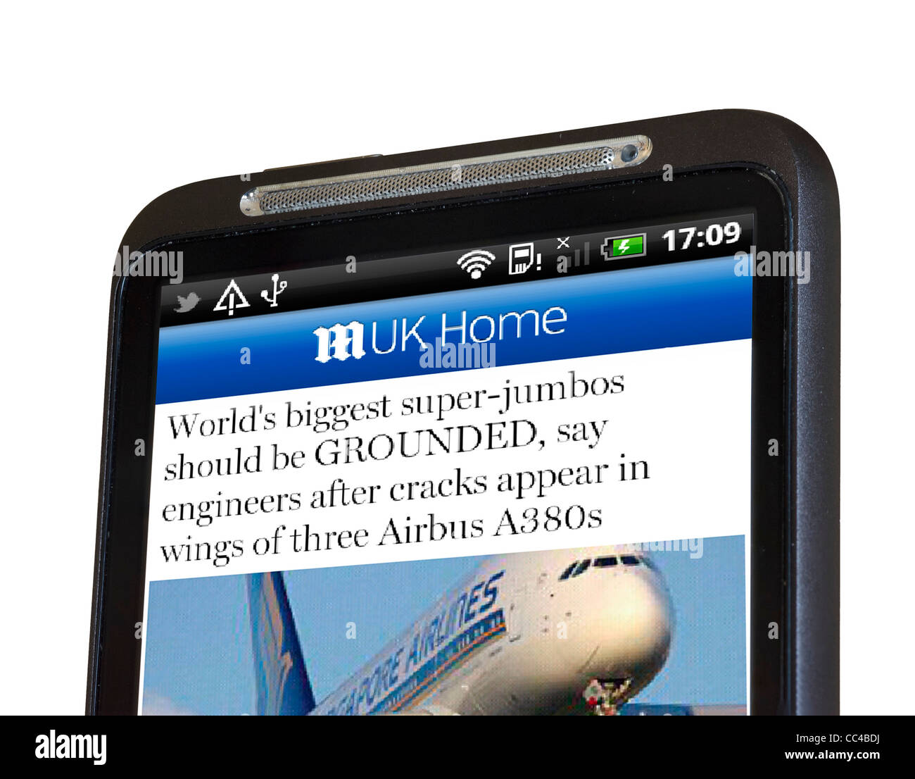 Reading The Daily Mail online newspaper via the android app on an HTC smartphone Stock Photo