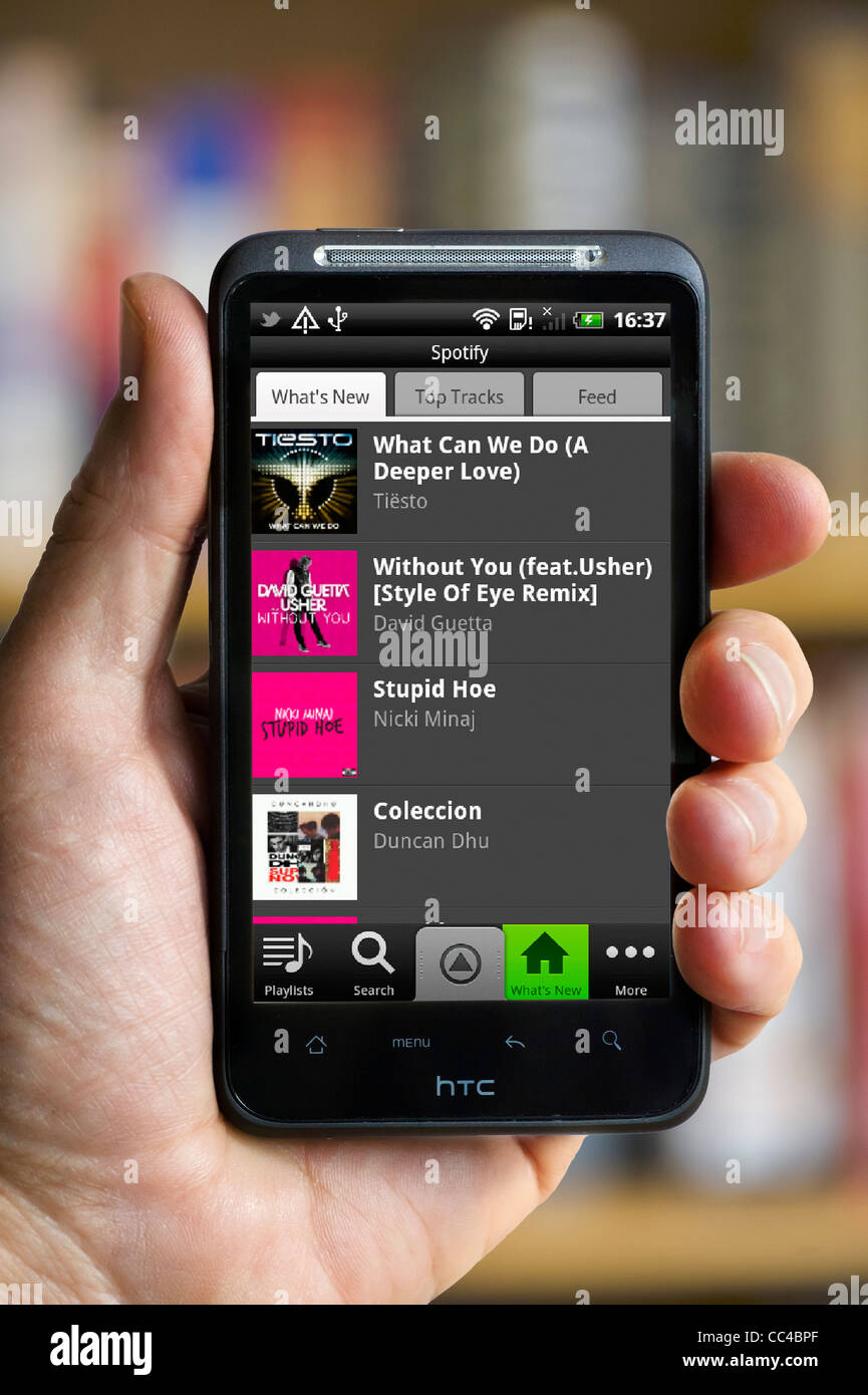 The internet music site Spotify on an HTC smartphone Stock Photo