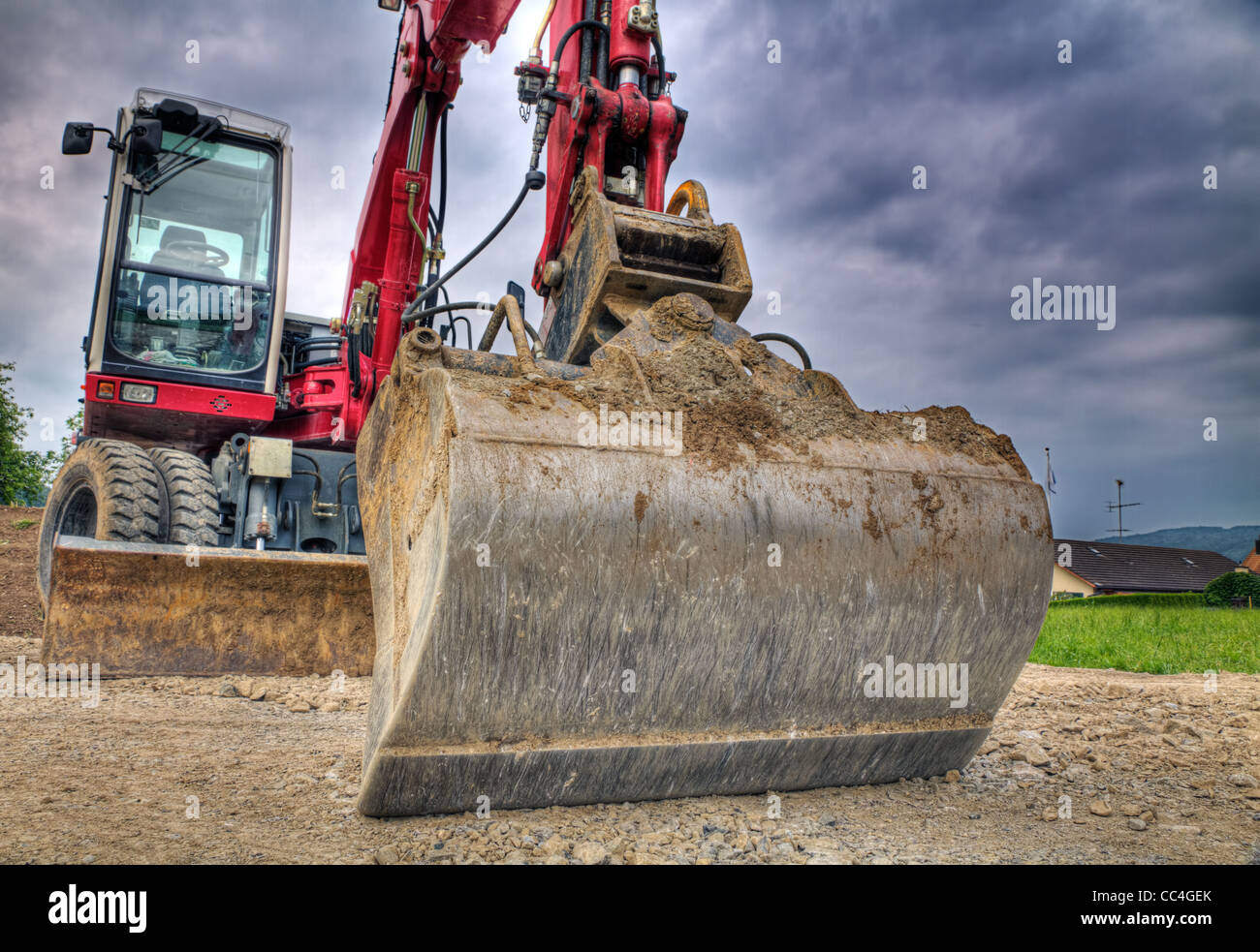 digger showing menacing strength, power, size, weight of this road construction vehicle Stock Photo