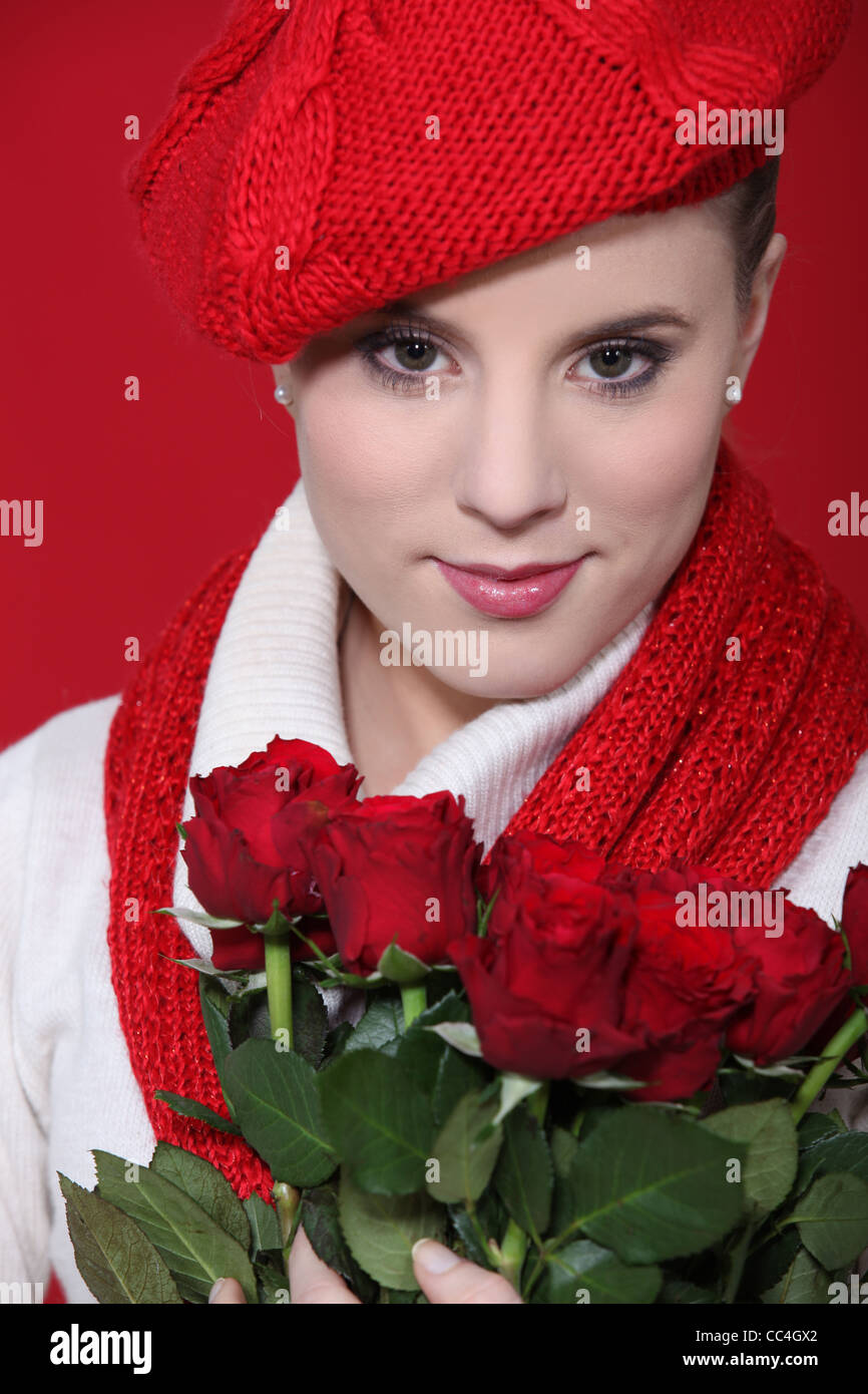 Stylish woman holding a bouquet of red roses Stock Photo - Alamy