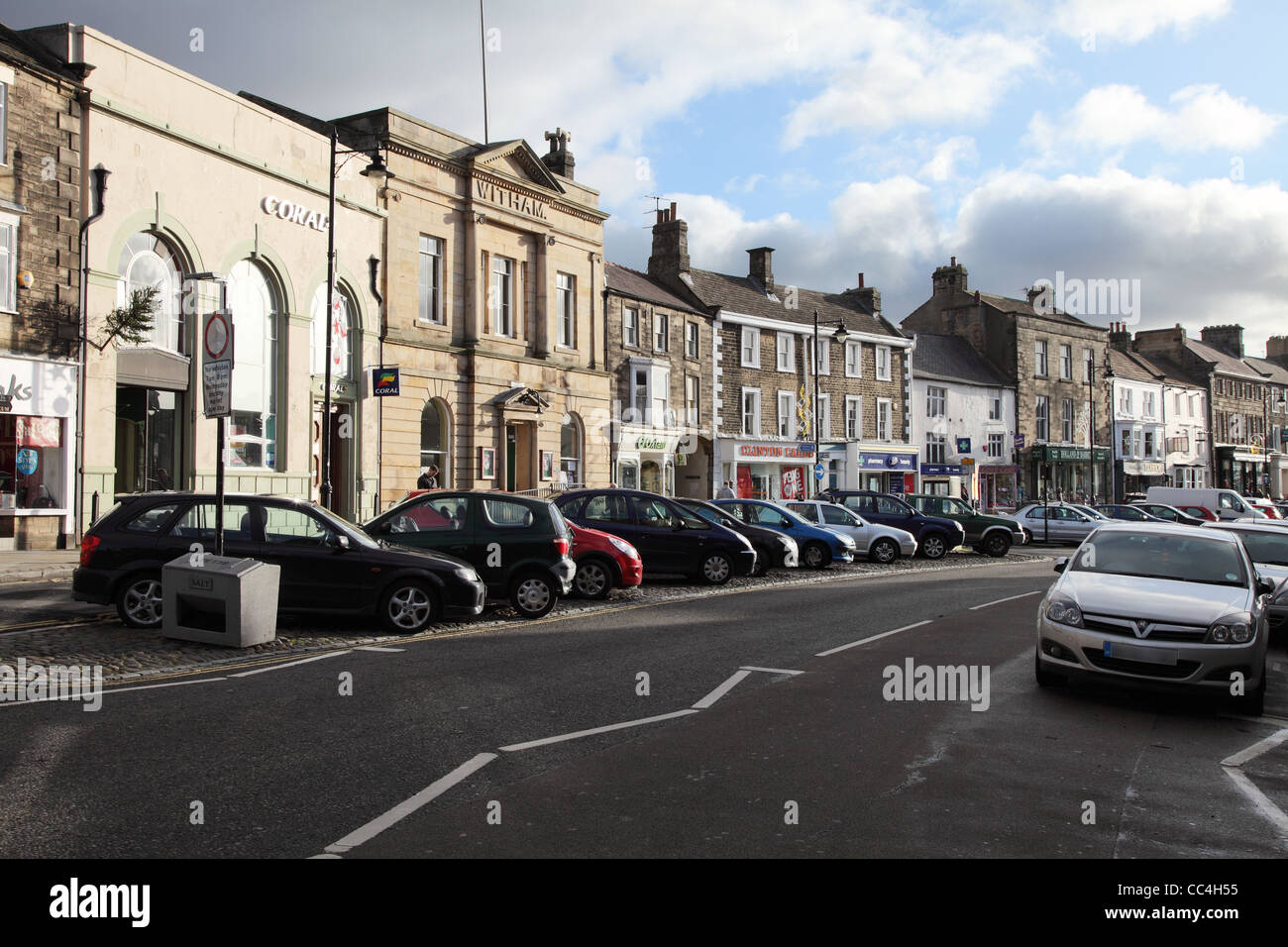 Cars parked along the length of the Market Place, Barnard Castle, north east England, UK Stock Photo
