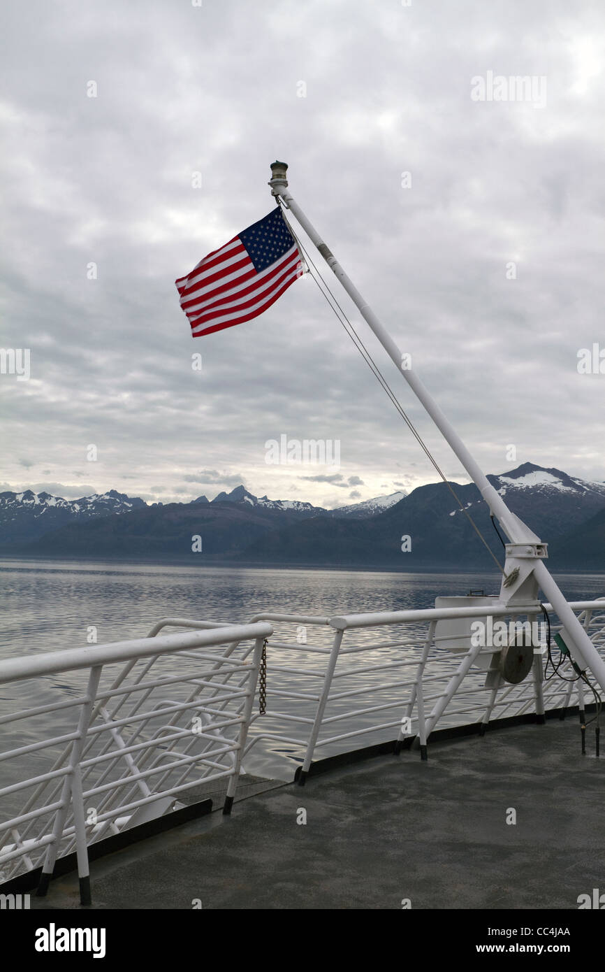 USA flag on Taku Ferry along the Inside Passage between Kake and Sitka, Alaska Stock Photo