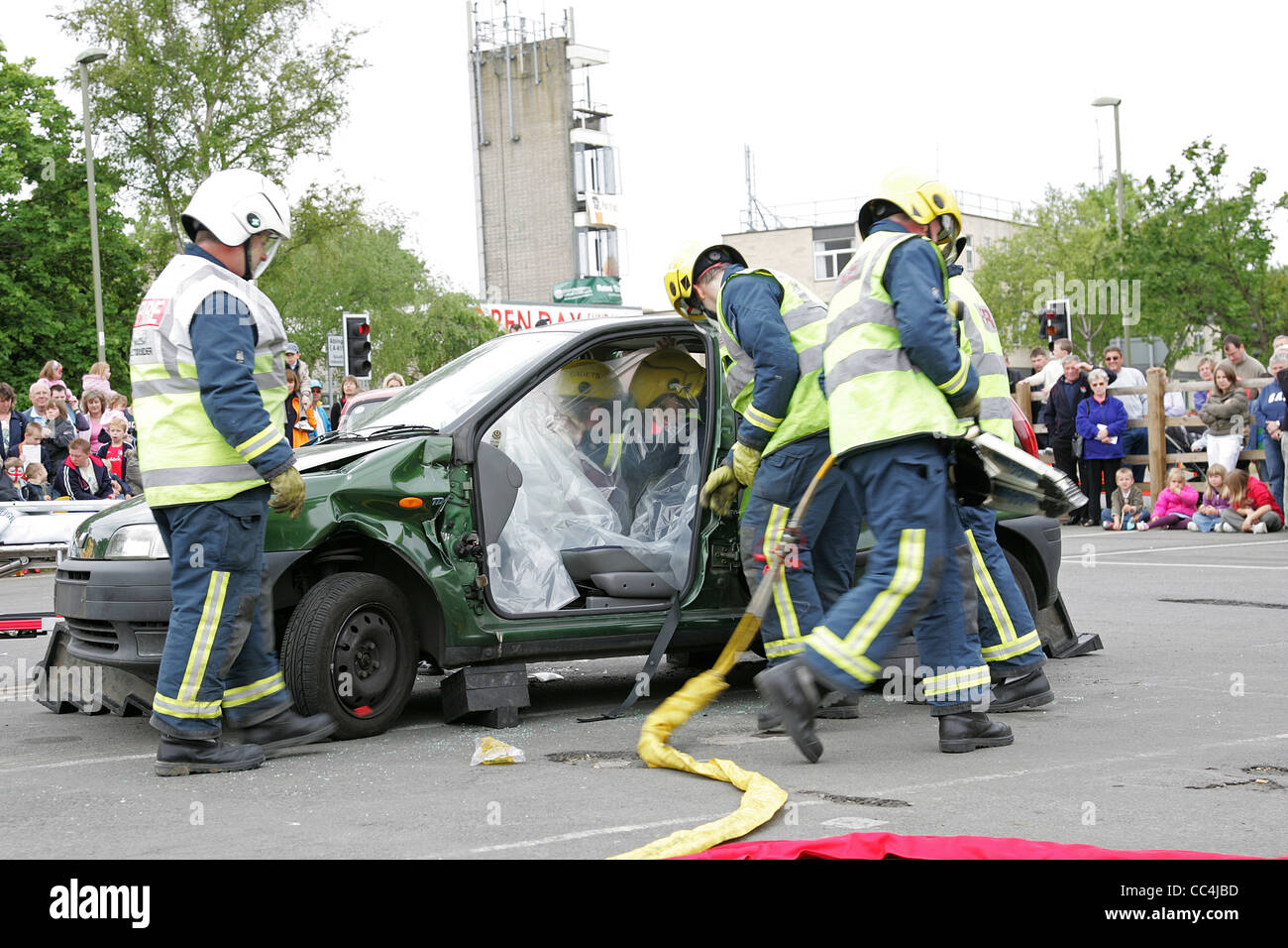 Fire Services Freeing Passengers from Wrecked Vehicle - Public Demonstration Stock Photo