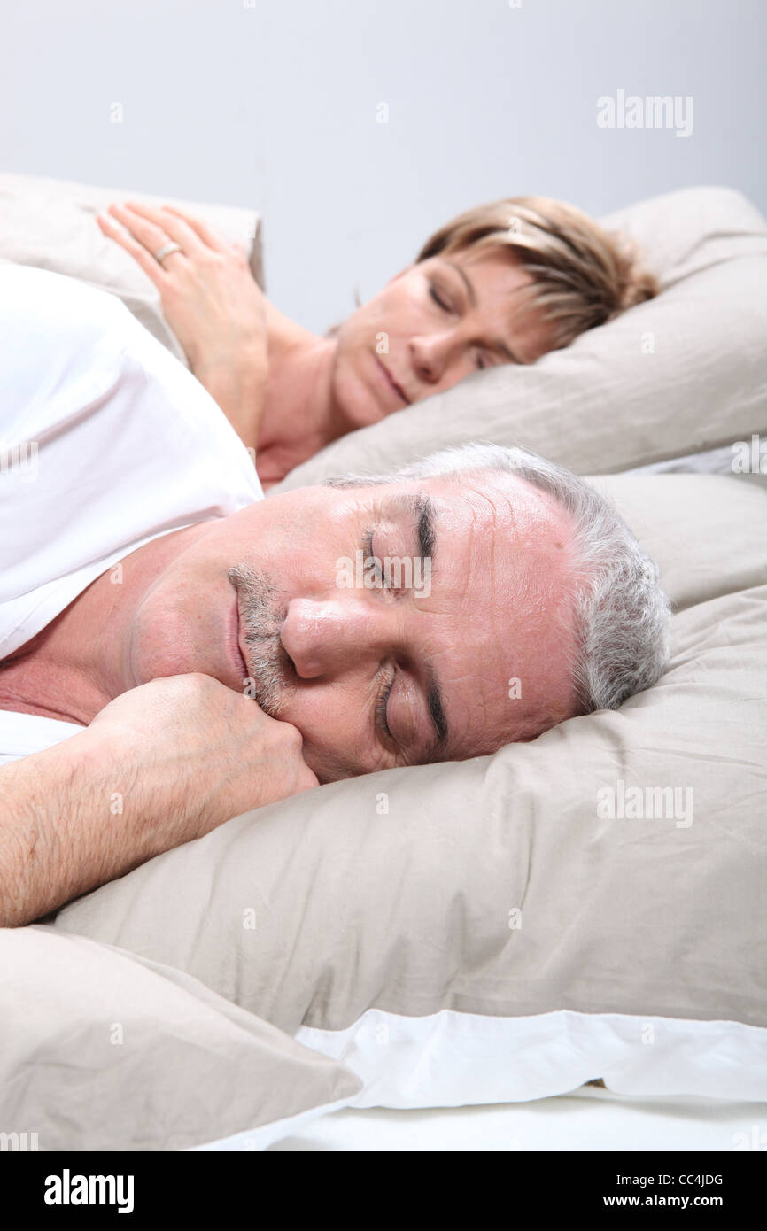 Couple in bed sleeping Stock Photo