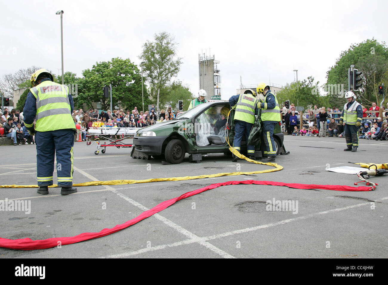 Fire Services Freeing Passengers from Wrecked Vehicle - Public Demonstration Stock Photo