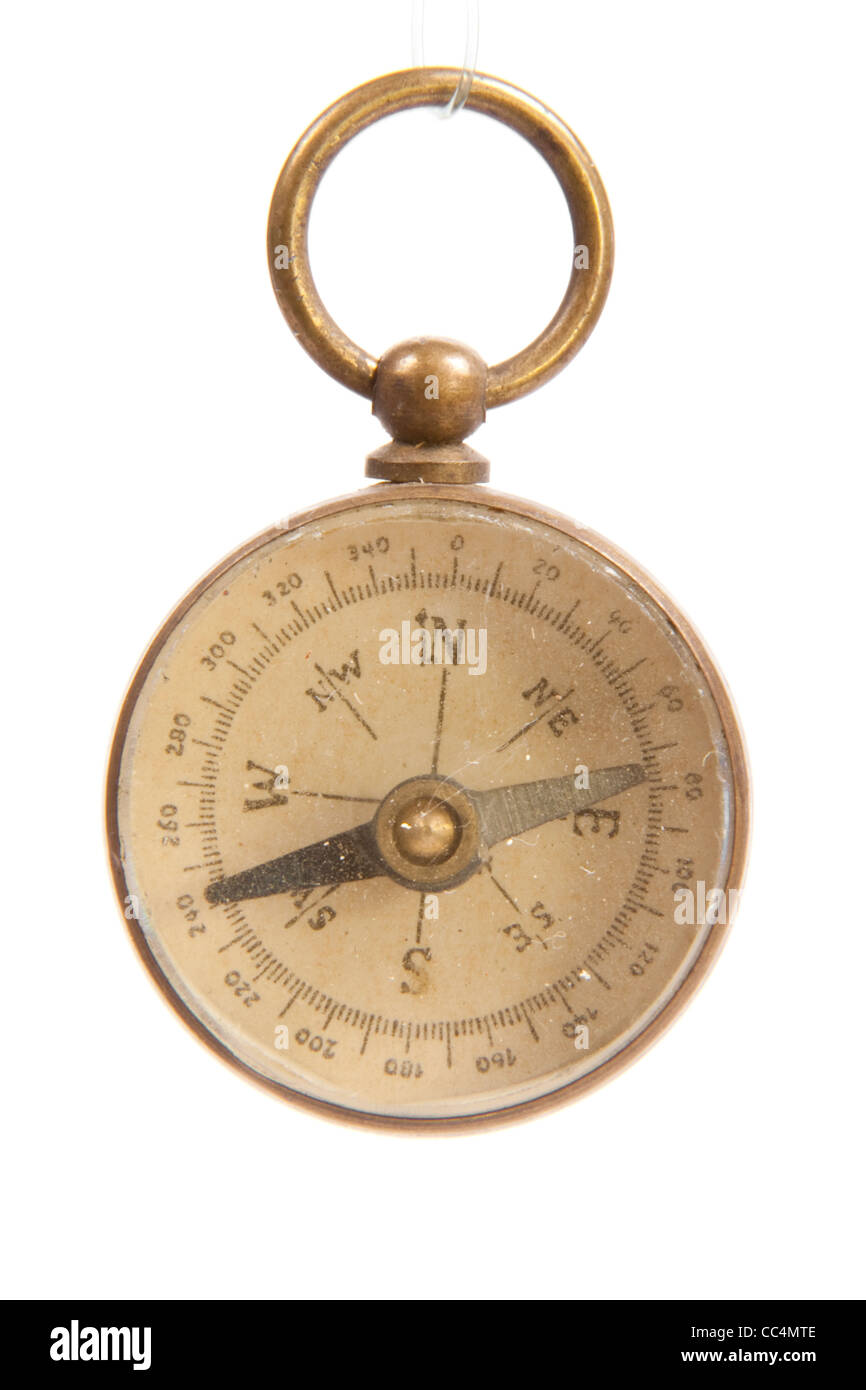 Antique Worn and Faded Old Brass Compass Close Up Isolated on White Background Stock Photo