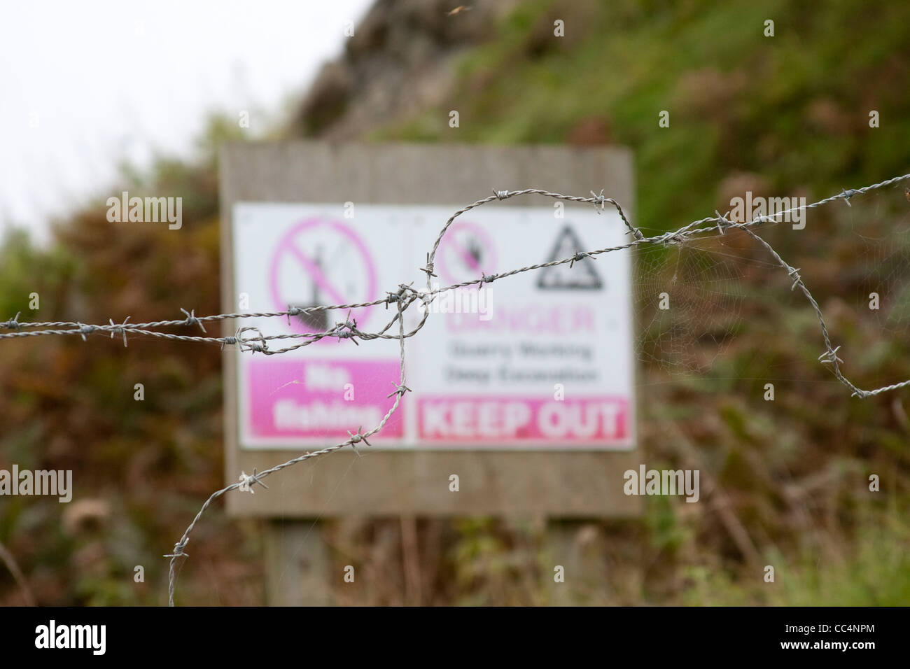 Danger Keep Out Sign  Focus Emphasis  Barbed Wire Stock Photo