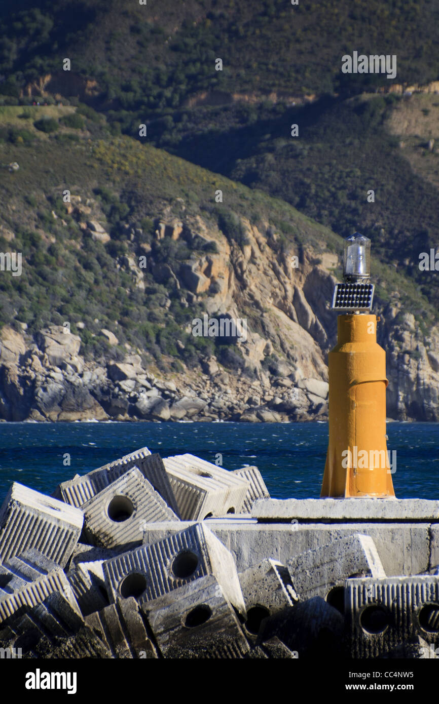 Yellow beacon in Cape Town with mountain backdrop Stock Photo