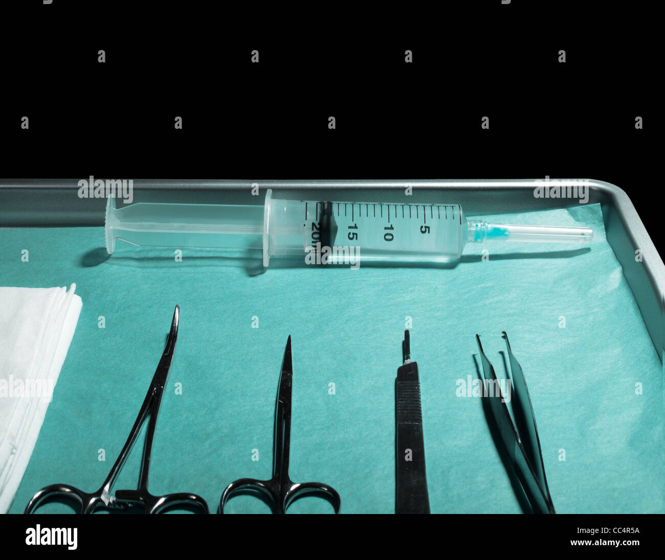 surgical tray with syringe and instruments Stock Photo