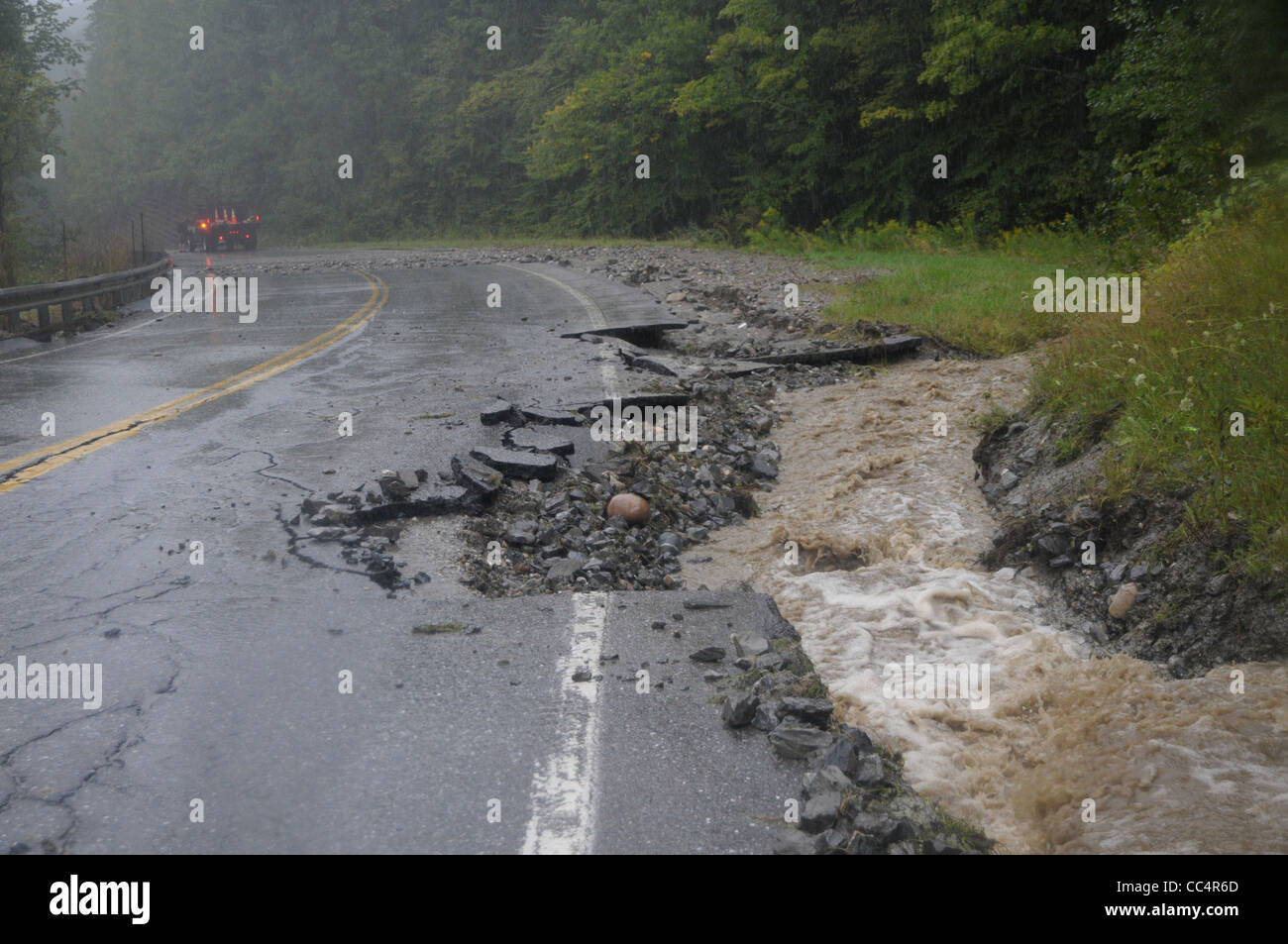 A road damaged by flood water in Starksboro, Vermont shows some of the