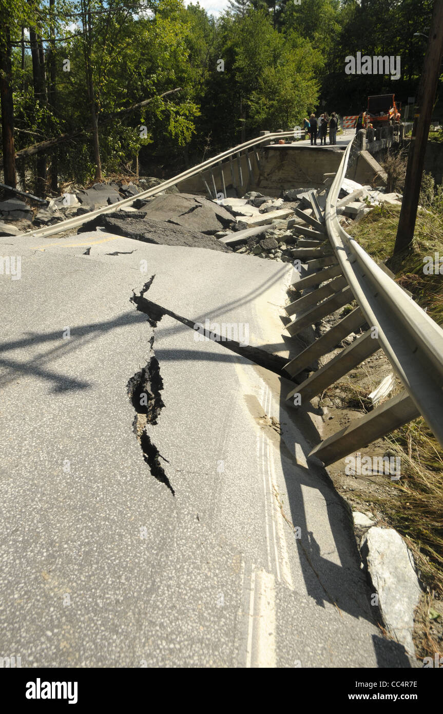 The road surface crumpled by tropical storm Irene shows the damage