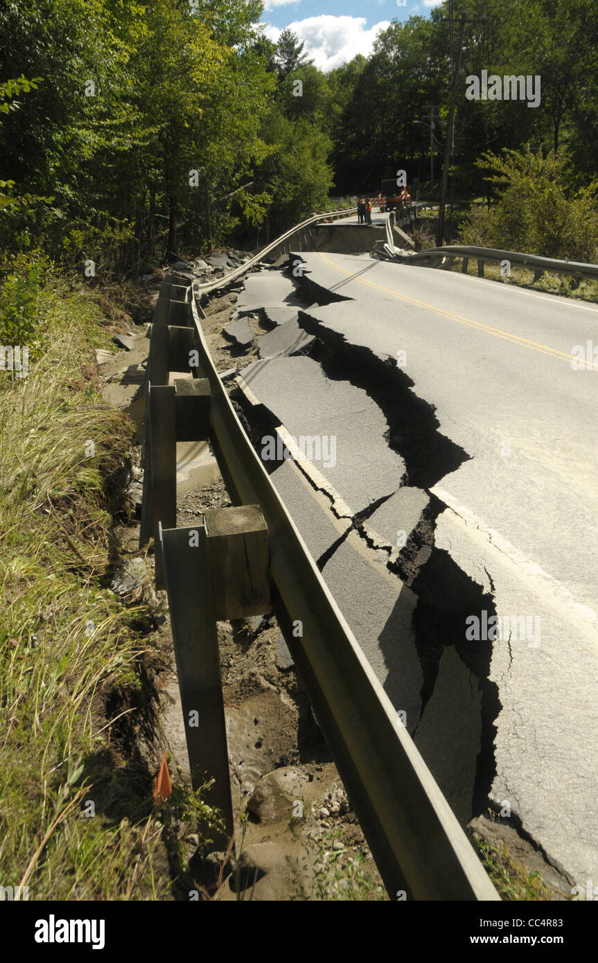The road surface crumpled by tropical storm Irene shows the damage