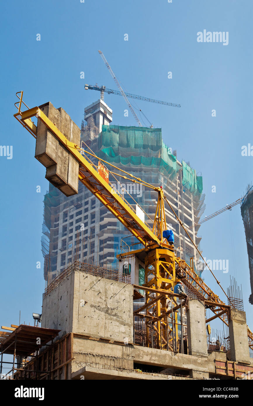 Mumbai, India urban sky covered with new developments and high rises with lifting cranes in clear blue skies instead of birds Stock Photo