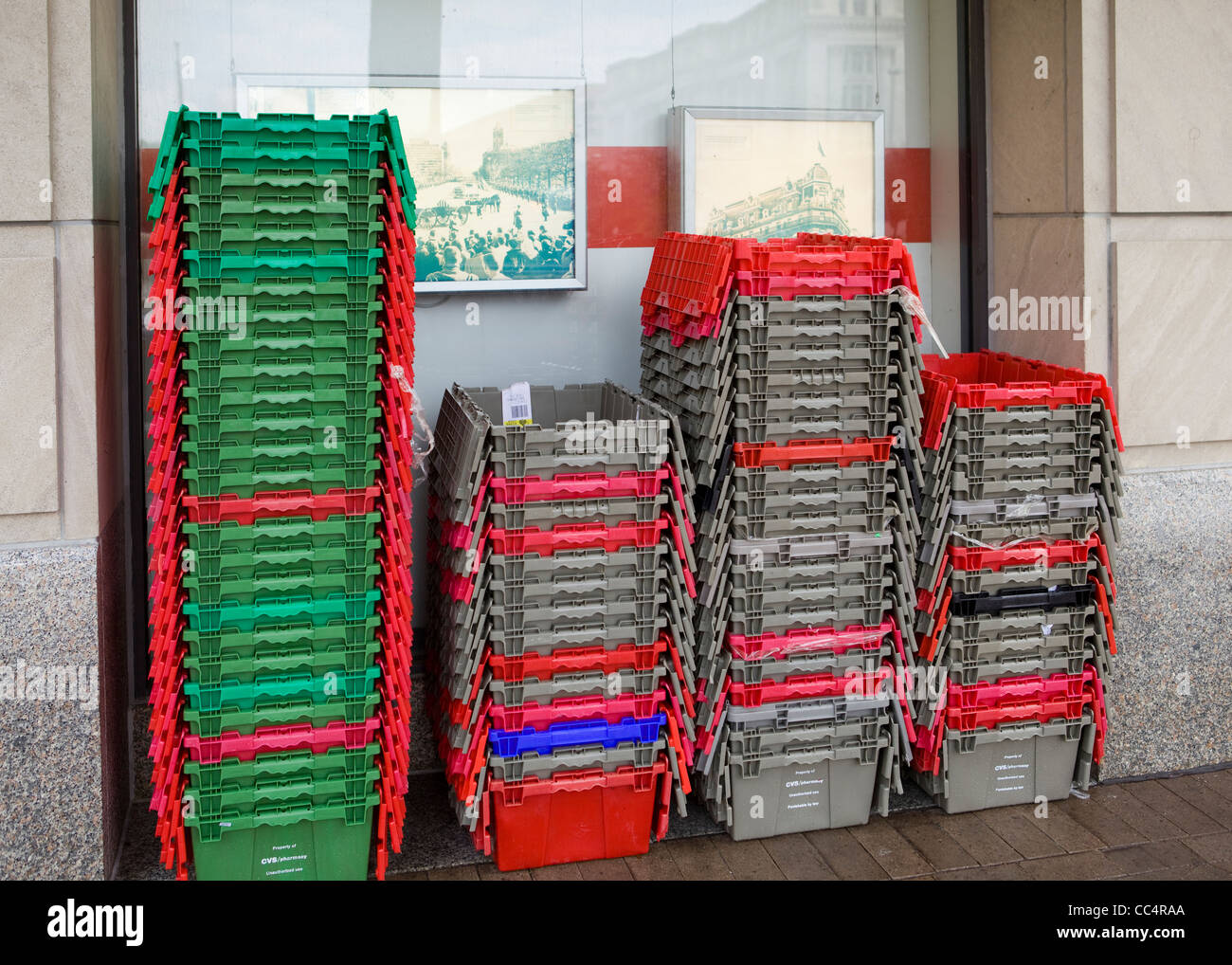 Stacked empty bins outside of retail store Stock Photo Alamy