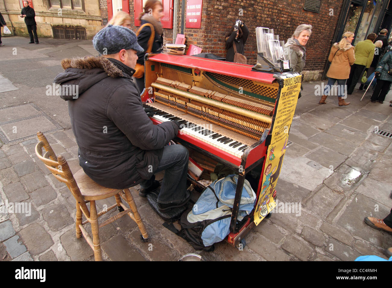 busker playing piano in street York UK Stock Photo - Alamy