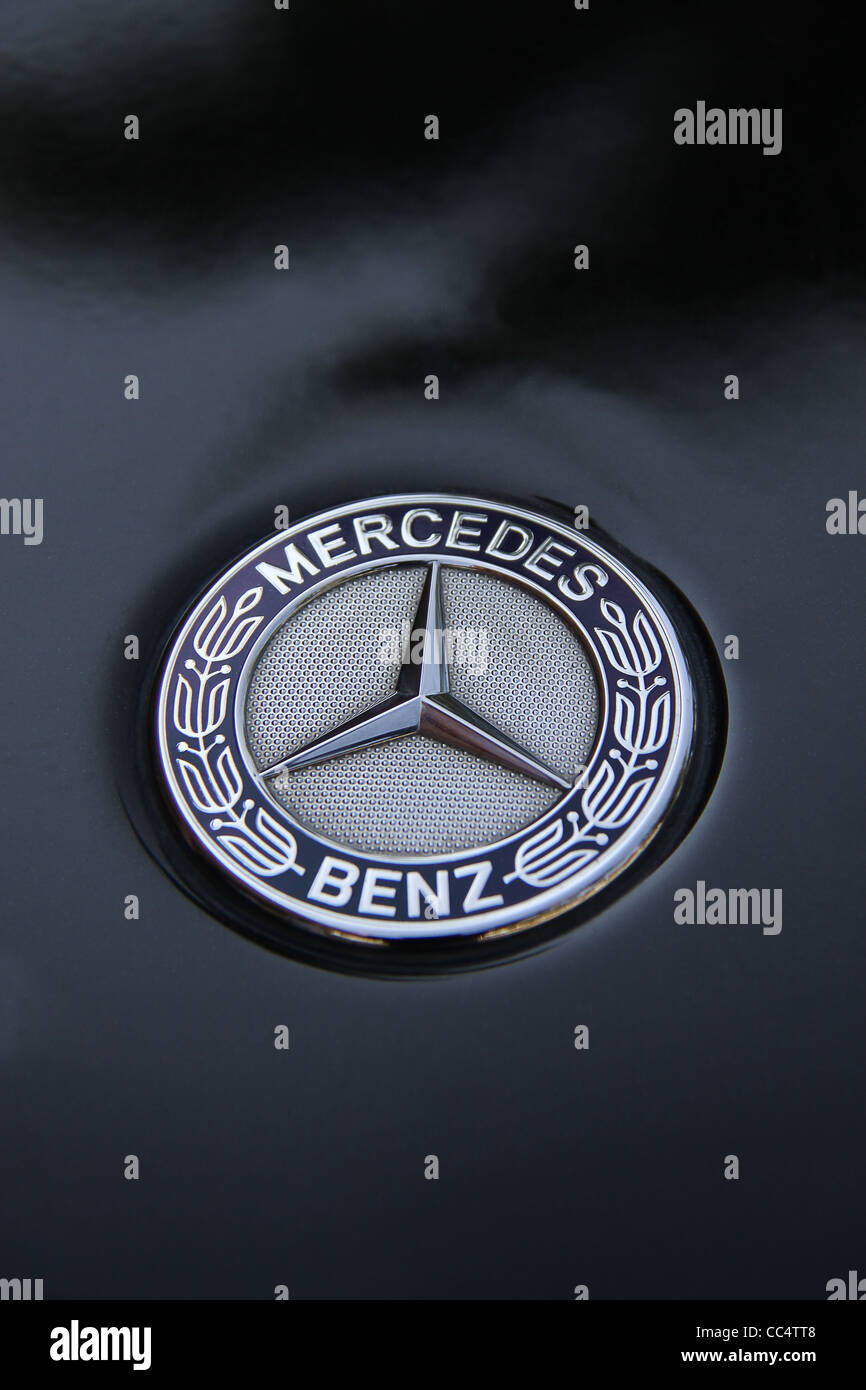 Mercedes Benz logo on black SUV Stock Photo