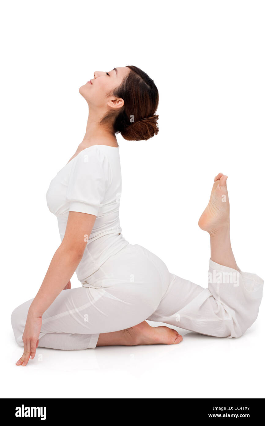 Young woman stretching on the floor Stock Photo - Alamy