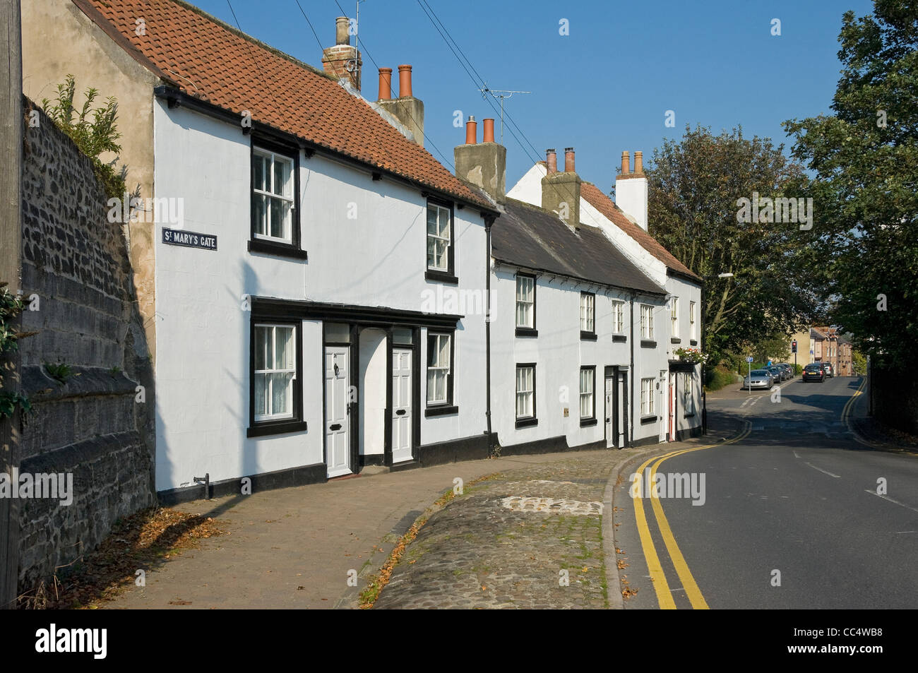 Row of white painted houses cottages St Mary's Gate Ripon North Yorkshire England UK United Kingdom GB Great Britain Stock Photo