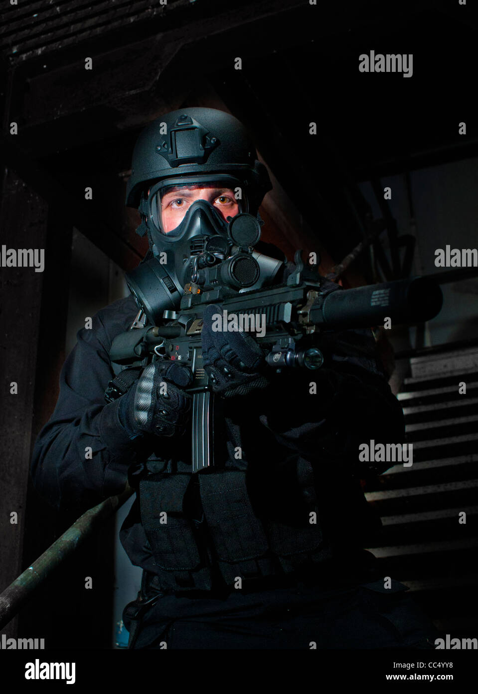 An airsoft player wearing special black forces uniform used in counter terrorist games (Posed by model) Stock Photo