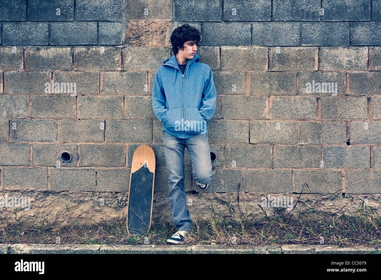 Young handsome boy in urban background Stock Photo