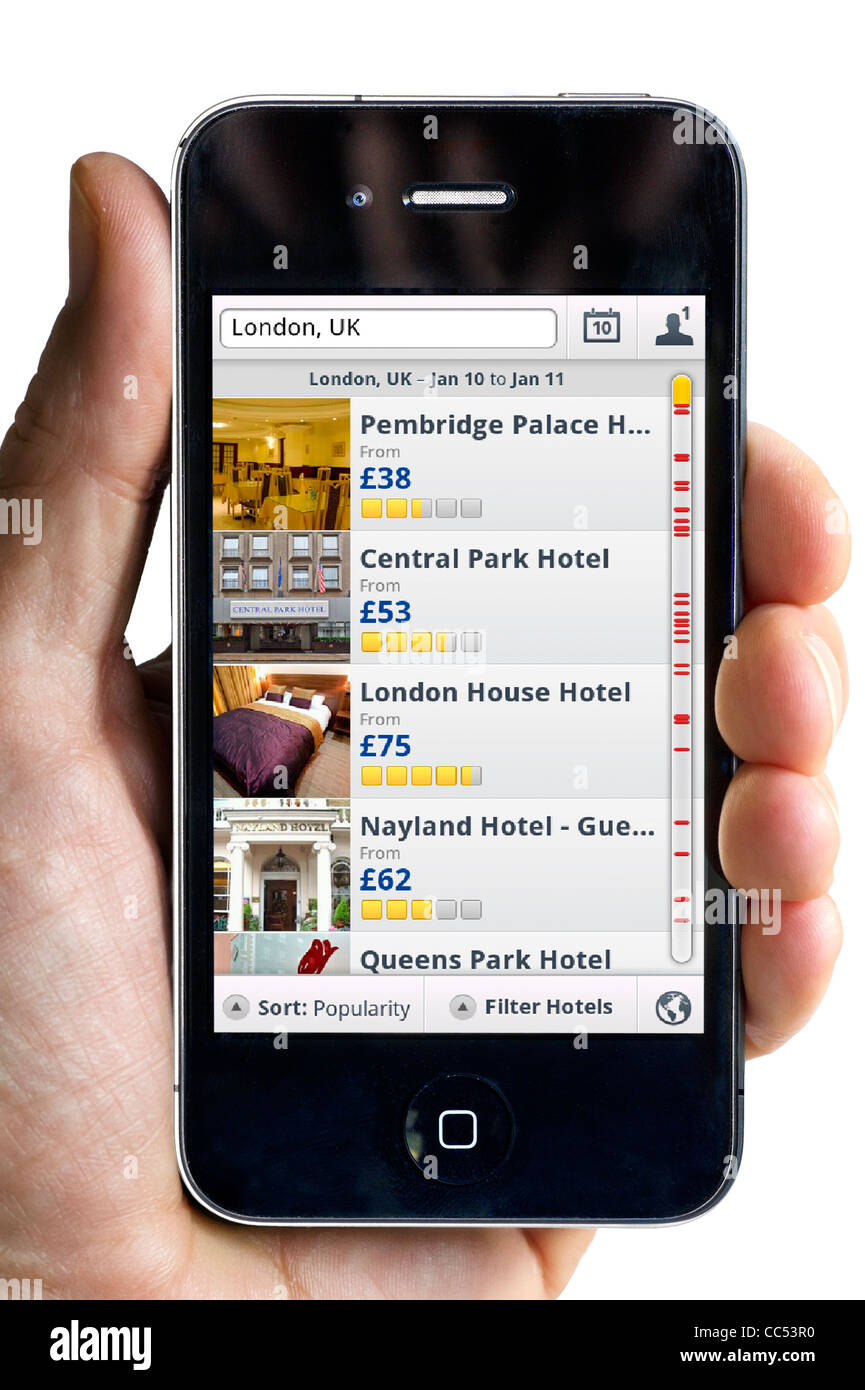 Using the Expedia Hotels app on an Apple iPhone 4 smartphone Stock Photo