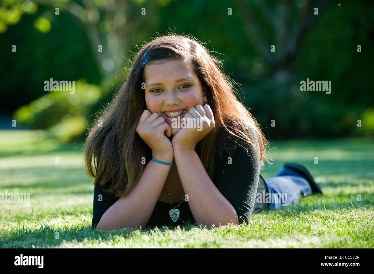 A Caucasian girl portrait in a park Stock Photo - Alamy