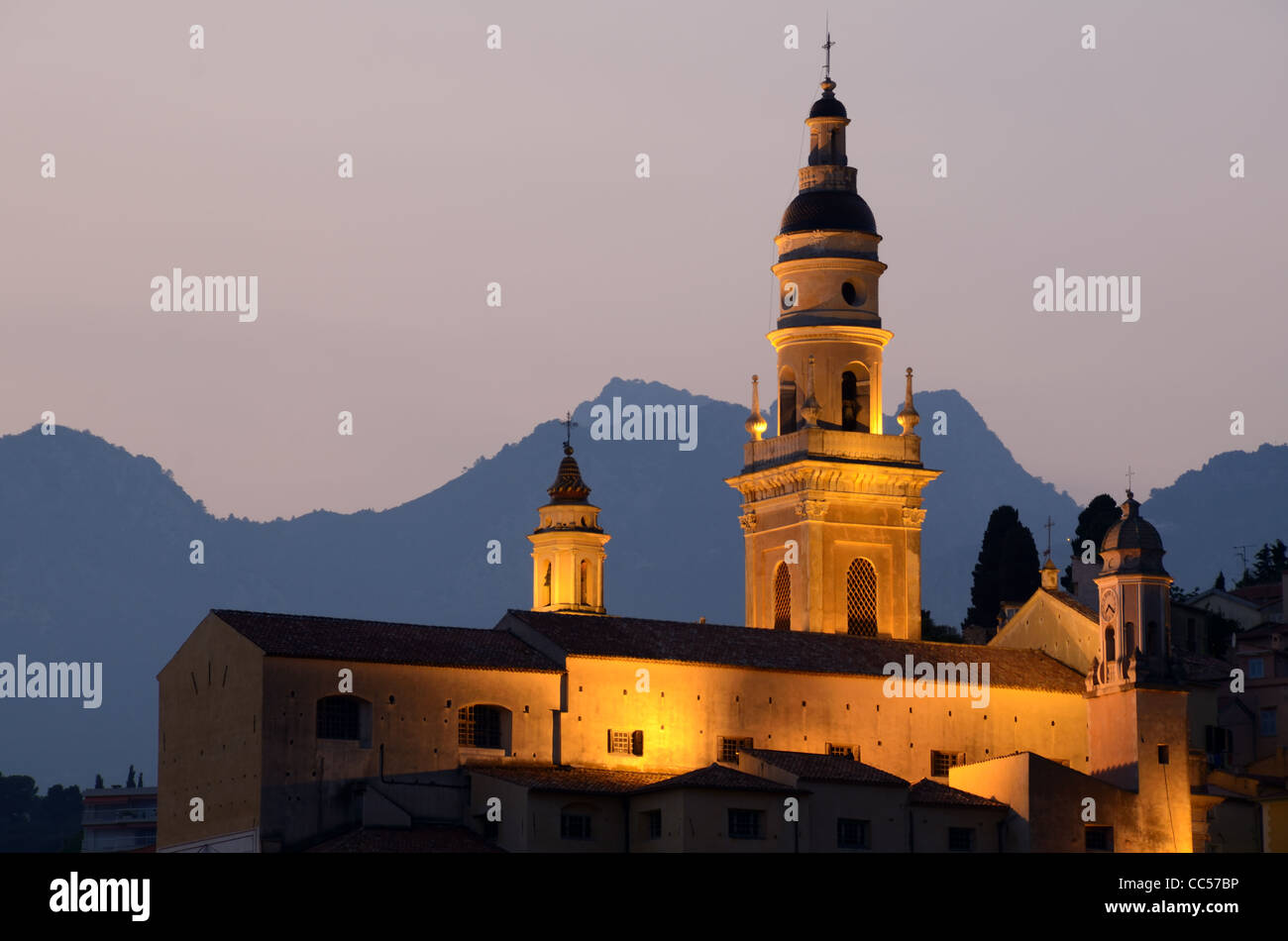 Menton Slyline at Dusk, Evening or Night View of Saint Michel Cathedral or Basilica (built 1653) in the Old Town or Historic District Menton France Stock Photo