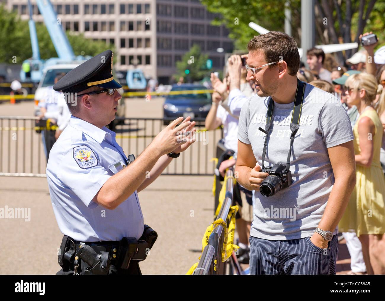 US Park Police officer talking with a civilian at a public protest - Washington, DC USA Stock Photo