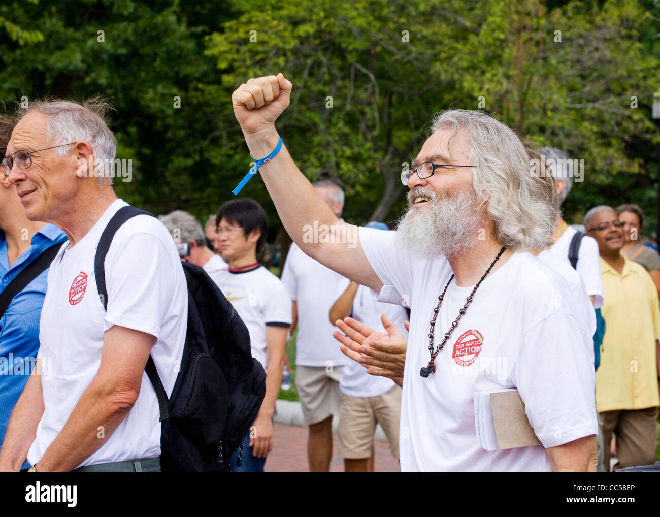 An elderly protester raises his fist Stock Photo