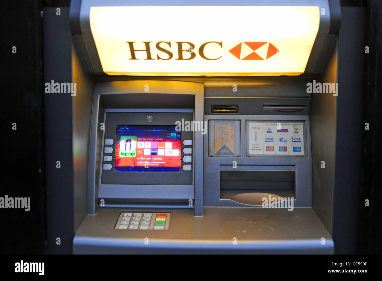 HSBC bank atm cash machine in wall British banking UK Stock Photo ...