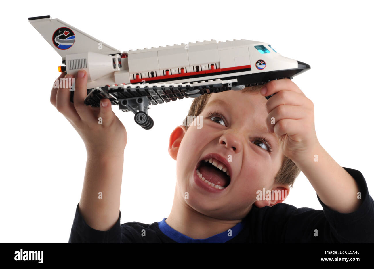 Lego, child playing with Lego space shuttle Stock Photo
