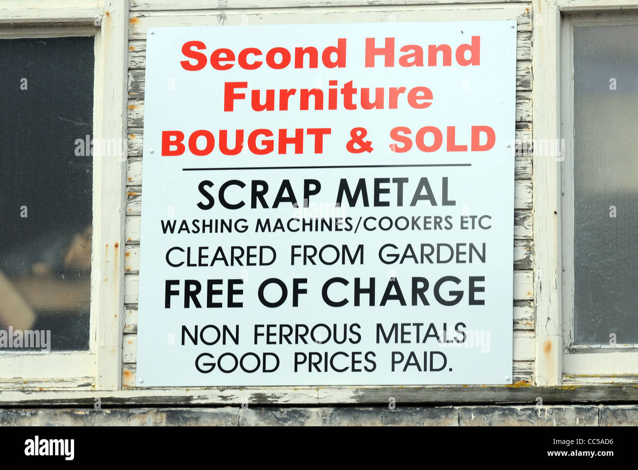 Second hand furniture and scrap metal merchant sign, UK Stock Photo